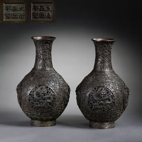 A pair of bronze dragon-patterned long-necked flasks from the Jiaqing period of the Qing Dynasty,