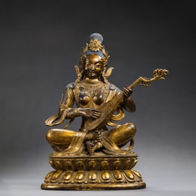 A CHINESE QING DYNASTY GILT BRONZE SEATED STATUE OF THE WONDERFUL SOUND OF BUDDHA