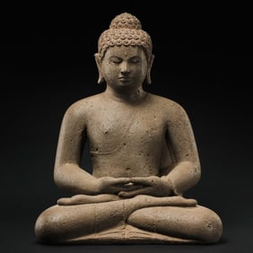 A 2ND CENTURY GANDHARA BLUESTONE STATUE OF A SEATED BUDDHA