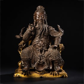 A CHINESE MING DYNASTY GILDED BRONZE STATUE OF GUAN YU