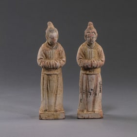 A PAIR OF HAN DYNASTY PAINTED POTTERY FIGURES