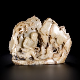 A CHINESE QING DYNASTY HETIAN JADE CARVING IN THE SHAPE OF A MOUNTAIN