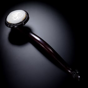A CHINESE QING DYNASTY ROSEWOOD INLAID WITH HETIAN WHITE JADE RUYI ORNAMENT