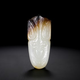 CHINESE HAN DYNASTY JADE WITH ANIMAL FACE PATTERN