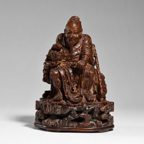 QING DYNASTY, CARVED SEATED FIGURE