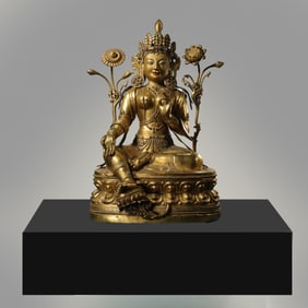 MING DYNASTY. GILT-BRONZE FIGURE OF A SEATED BUDDHA.