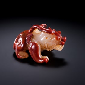 BEFORE THE MING DYNASTY, RED AGATE AUSPICIOUS BEASTS DURING THE WARRING STATES PERIOD