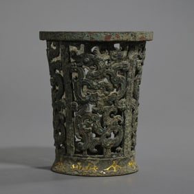 BEFORE THE MING DYNASTY, A CYLINDER WITH DRAGON PATTERNS INLAID IN GOLD AND SILVER DURING THE