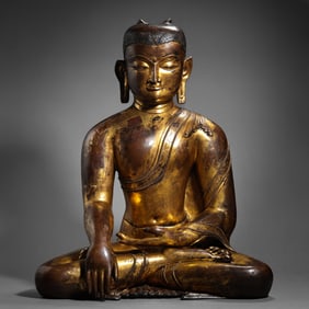 13-14A GILT-BRONZE STATUE OF A SEATED BUDDHA FROM THE YUAN DYNASTY