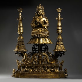 MING DYNASTY. GILT-BRONZE FIGURE OF A SEATED BUDDHA.