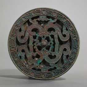 BEFORE THE MING DYNASTY, CARVED BRONZE MIRROR FROM THE WARRING STATES PERIOD