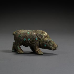 BEFORE THE MING DYNASTY, A PIG INLAID WITH GOLD, SILVER AND TURQUOISE DURING THE WARRING STATES