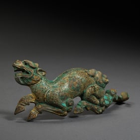 BEFORE THE MING DYNASTY, AUSPICIOUS BEASTS INLAID WITH GOLD AND TURQUOISE DURING THE WARRING STATES