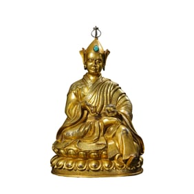A Chinese Ming Dynasty gilt bronze statue of Guru Padmasambhava