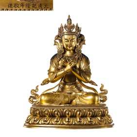 A Chinese gilt bronze statue of a seated Buddha from the Qianlong period of the Qing Dynasty