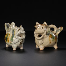 A pair of Chinese Tang Dynasty Changsha kiln dotted auspicious beasts