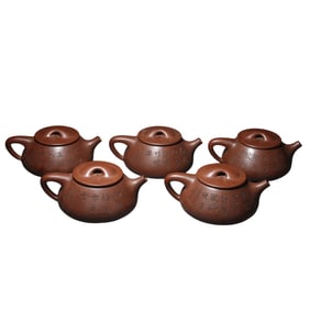 A group of ancient Chinese celebrity purple clay teapots