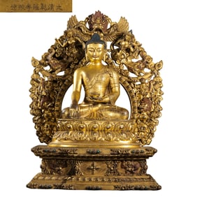 A Chinese gilt bronze statue of a seated Buddha from the Qianlong period of the Qing Dynasty
