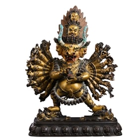 A Chinese gilt bronze statue of a standing Buddha from the Qianlong period of the Qing Dynasty