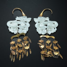 A pair of Chinese Liao Dynasty Hetian jade dragon earrings