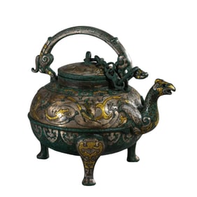 A Chinese Warring States Period gold and silver inlaid tripod phoenix head handle pot