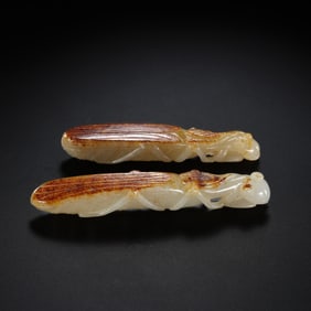 A pair of Hetian white jade red-skinned mantises from the Qing Dynasty, China