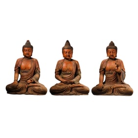 A group of Chinese Ming Dynasty woodcarvings of seated Buddhas