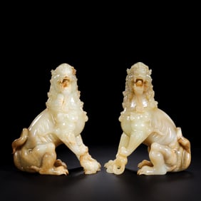 A pair of Chinese Han Dynasty jade lion statues