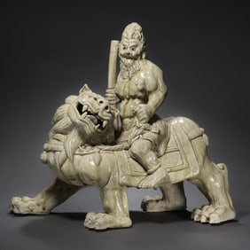 Chinese Sui Dynasty Xiangzhou Kiln Celadon Hu Man Riding a Lion