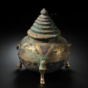 A Chinese Tang Dynasty silver-gilt tripod censer with a lid