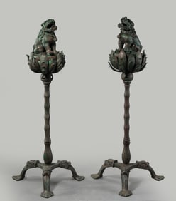 A pair of Chinese Liao Dynasty bronze lion-shaped incense burners