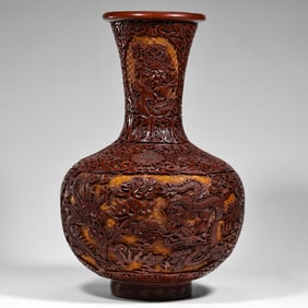 Chinese Qing Dynasty Qianlong period carved red long-necked vase with double dragons playing with