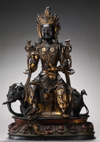 A Chinese Ming Dynasty gilt bronze statue of a seated Buddha