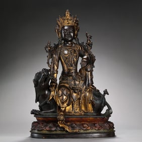 A Chinese Ming Dynasty gilt bronze statue of a seated Buddha