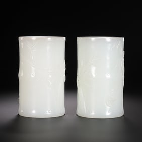 A pair of Chinese Qing Dynasty Hetian white jade brush holders with bamboo patterns