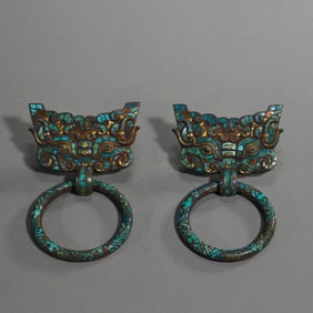 A pair of gold and silver inlaid door knockers from the Warring States Period of China