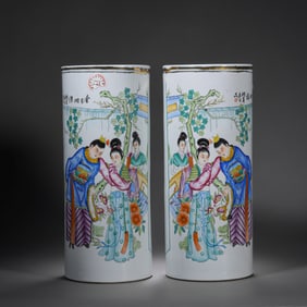 A pair of Chinese Qing Dynasty famille rose brush holders with figures and stories