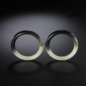 A pair of Chinese Qing Dynasty Hetian jade bracelets