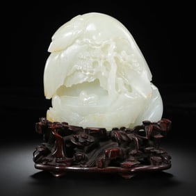 A Chinese Qing Dynasty Hetian white jade carved mountain-shaped ornament