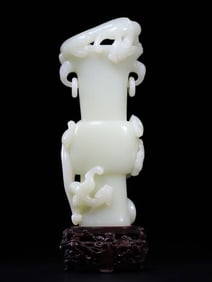 A Chinese Qing Dynasty Hetian white jade vase with dragon patterns