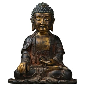 A Chinese Ming Dynasty gilt-bronze statue of seated Sakyamuni Buddha