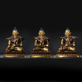 A group of Chinese Qing Dynasty gilt-bronze statues of the Three Buddhas