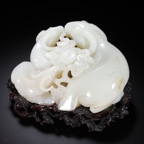 A Chinese Qing Dynasty Hetian white jade carving of "Three Yangs Bringing Good Luck"