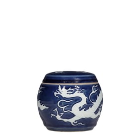 A Chinese Yuan Dynasty blue-glazed jar with a white dragon pattern