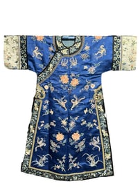 A Chinese Qing Dynasty blue satin cloak with embroidered "flower and butterfly" patterns