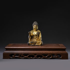 A Chinese Liao Dynasty gilt-bronze seated Buddha statue