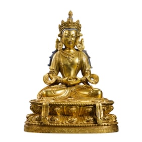 A Chinese Qing Dynasty gilt bronze statue of a seated Buddha