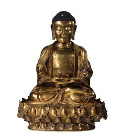 A Chinese Ming Dynasty gilt-bronze statue of seated Sakyamuni Buddha