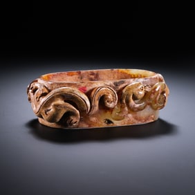 Chinese Han Dynasty jade artifact with dragon pattern