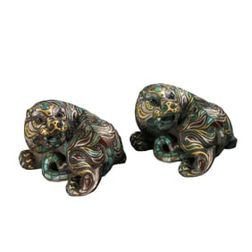 A pair of gold and silver inlaid auspicious beasts from the Warring States Period of China